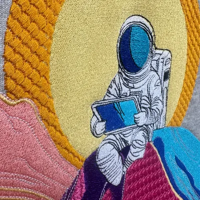 Broderie détaillée : illustration astronaute